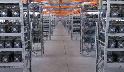 A large-scale mining farm with rows of active miners