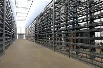 A modern mining farm with numerous mining rigs