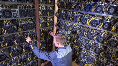 Vast mining farm facility in Kazakhstan with rows of mining machines operating